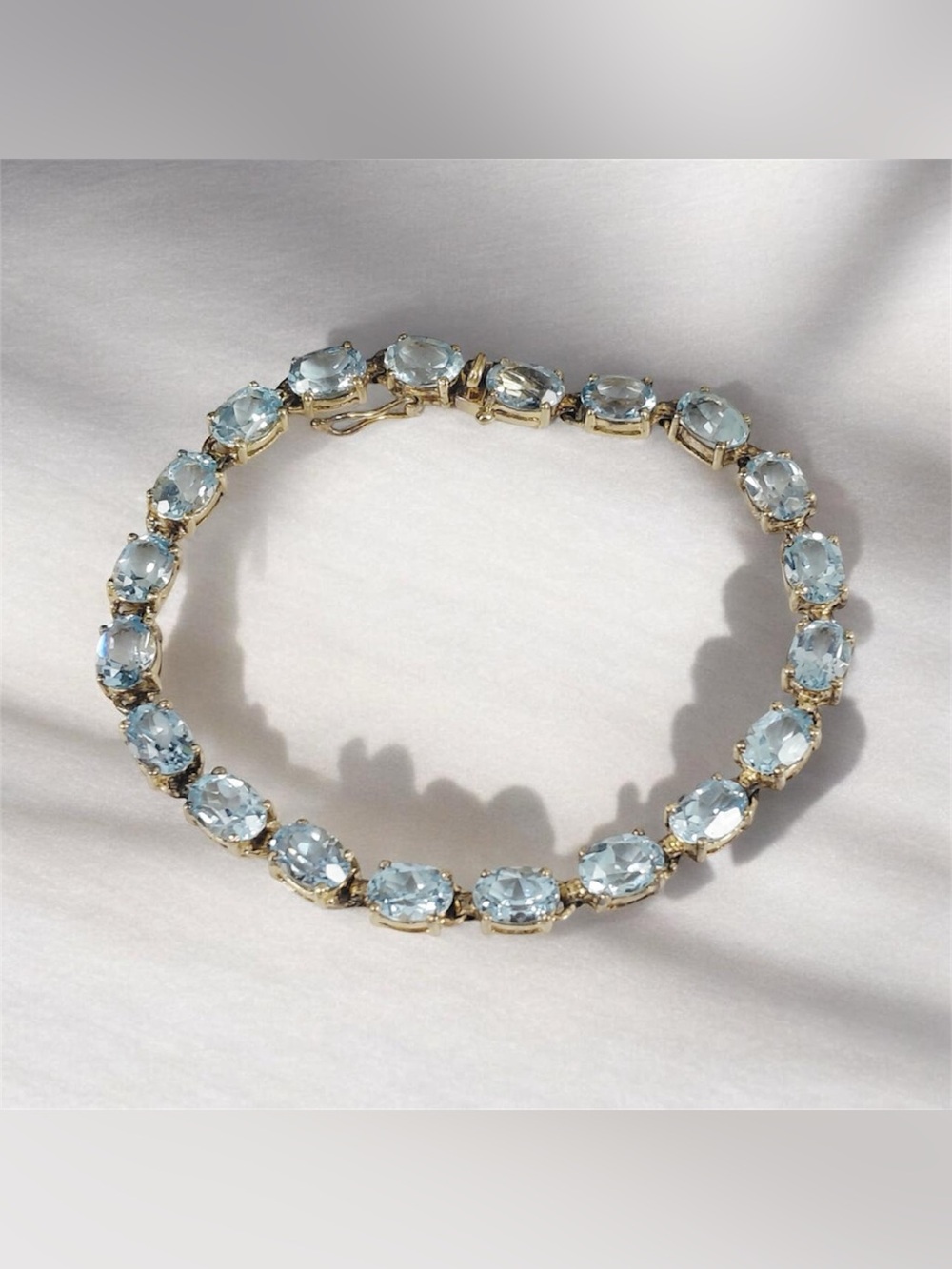 Gold-Tone Blue Topaz  Tennis Bracelet - Light Blue Elegance 7”
